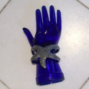 Silvertone textured starfish bracelet.